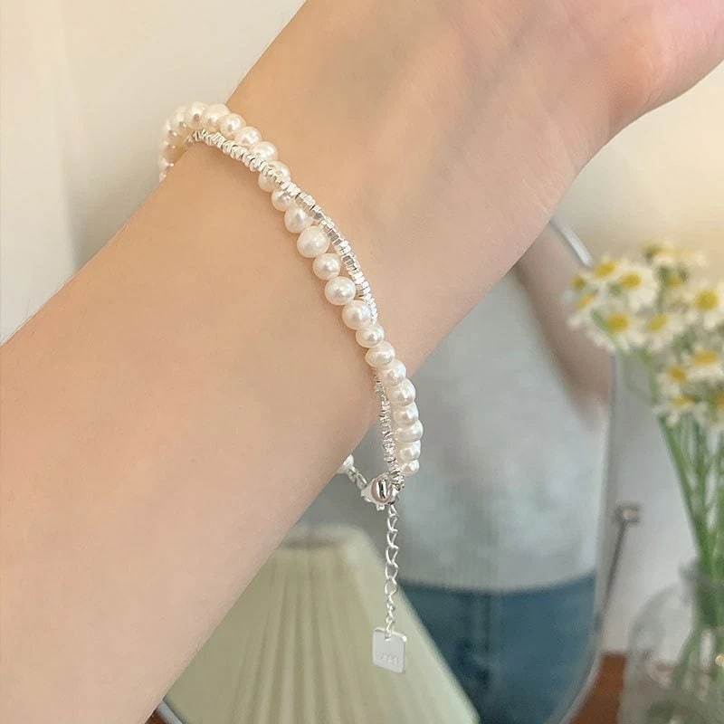 925スターリングシルバーの重工業の真珠は銀のビーズのブレスレットの女性の軽い贅沢なニッチの繊細なビーズを押しつぶした