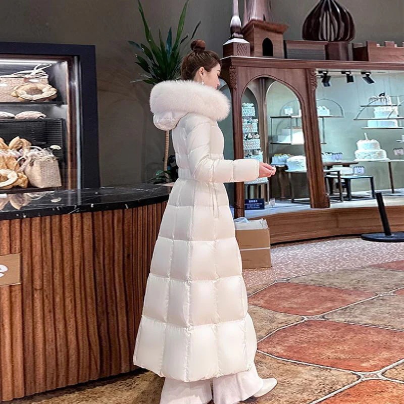 ロング丈 デザインセンス フード付き 受け取って腰 ダウンコート 2025 冬 新しい ホワイト 大きな毛の襟 中綿ジャケット