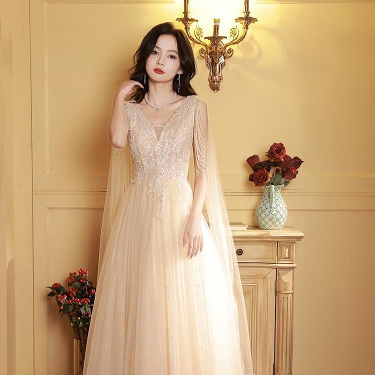 女性のためのシャンパンカラードレス2025春と秋のタッセルvネックコレクションvコレクションショルダーボーカルアート試験ドレス