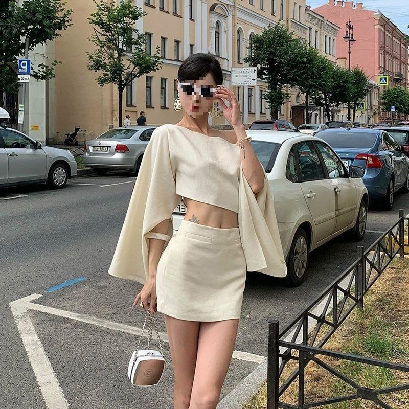 女性用斜め肩長袖トップスとスカートスーツ秋のシックなデザイン軽くて大人っぽいスタイルのスリムフィット2点セット