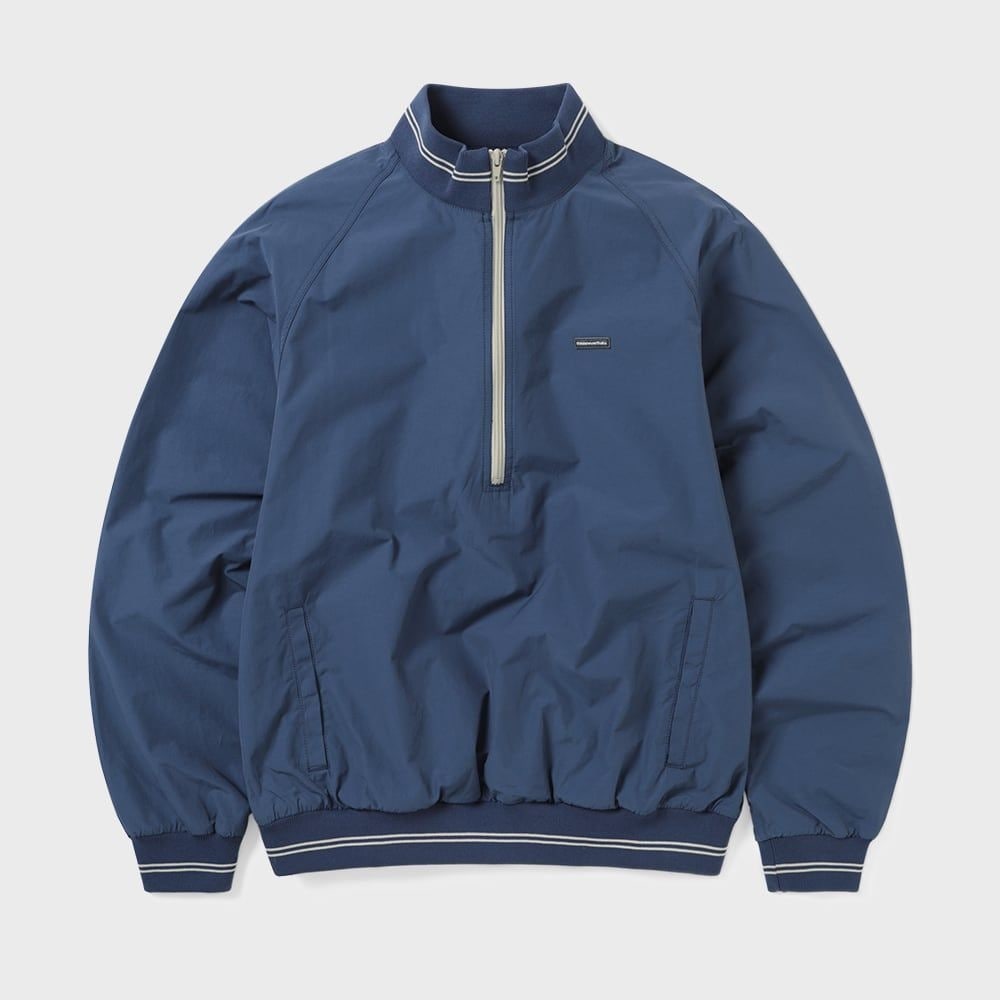 ディス・イズ・ネヴァー・ザットのナイロンハーフジッププルオーバーブルー