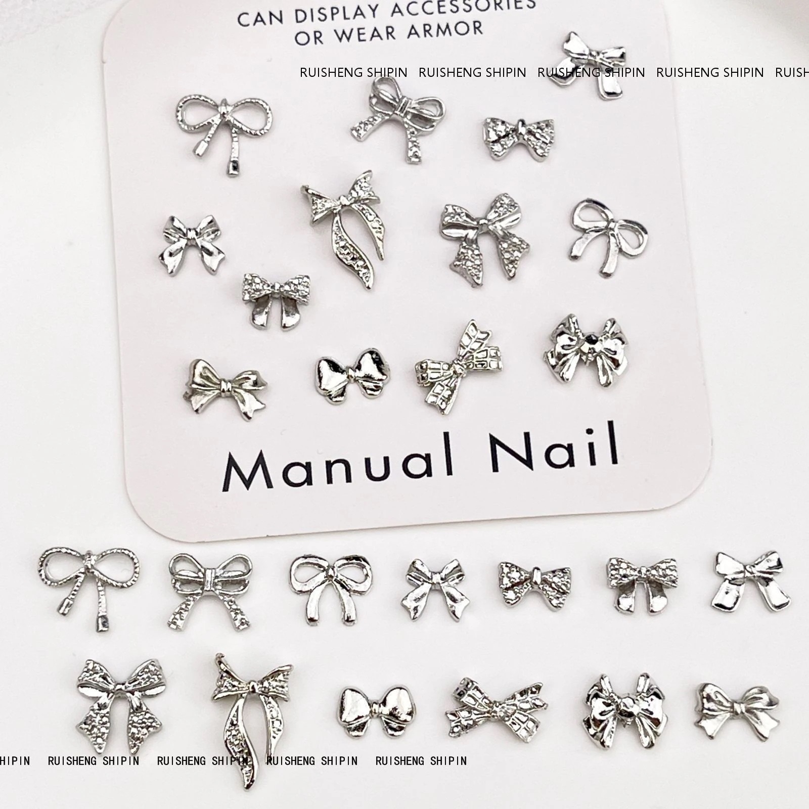 【10個セット】粒入合金の蝶結びのネイルアクセサリーのレトロで軽い豪華な白k色のリボンの銀色の蝶ネクタイの爪のアクセサリー