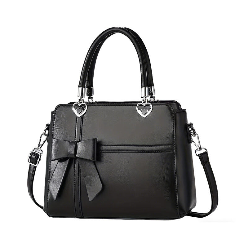 しっかりとした色のデザインとリボンの装飾が特徴のこのハンドバッグは合成素材で作られておりジッパーで閉じるタイプで毎日の使用に多用途なオプションです