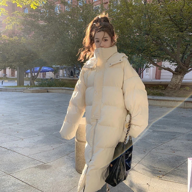 オフホワイトの女性用ロングコットンコート冬新作ルーズ韓国風肥厚フード付きコットンコート暖かいガールズジャケット