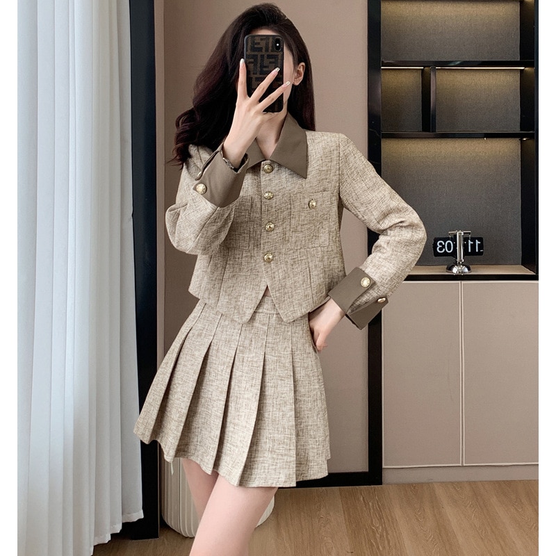 2024秋の新しい気質はフランスの小さな香り風レトロなスーツのプリーツスカートの2セットをつなぎ合わせた