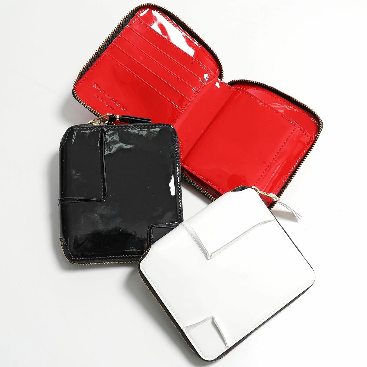 COMME des GARCONS コムデギャルソン 二つ折り財布 REVERSED HEM SA2100RH メンズ ラウンドファスナー 小銭入れあり レザー カラー3色 28,037円