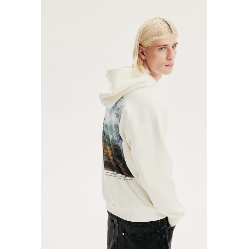 H&M ルーズフィットプリントフーディークリーム/インナーサンクタム