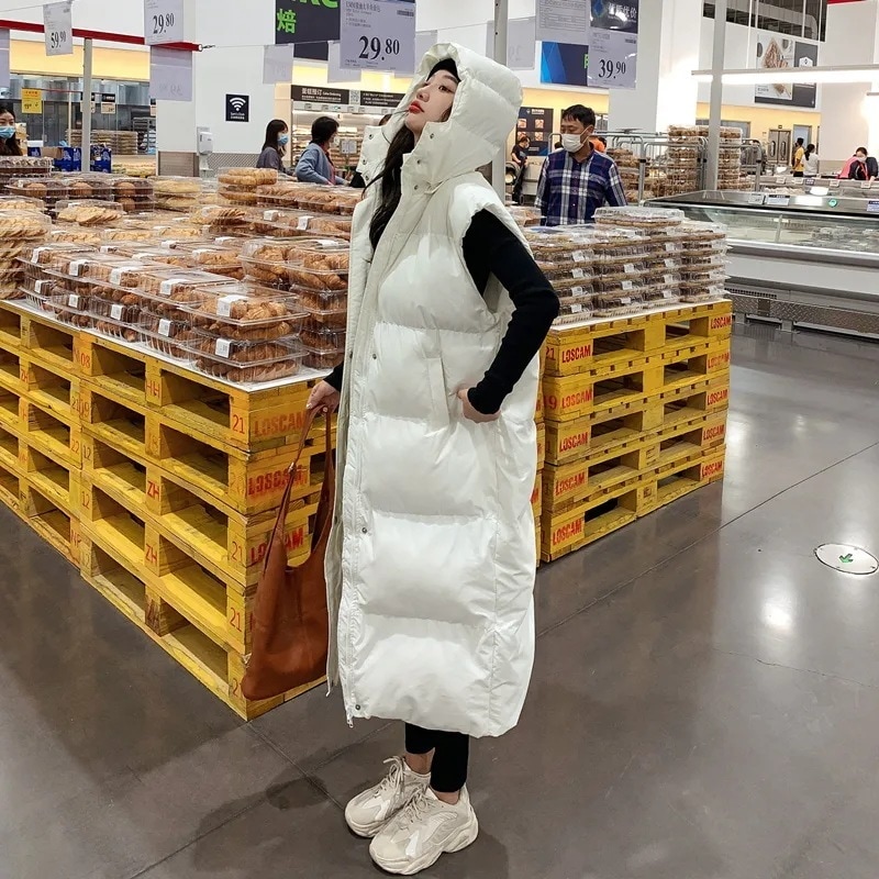 膝丈のロングサイズの綿入れベスト女性秋冬ギャザー百合カジュアル学生帽付きベストコート