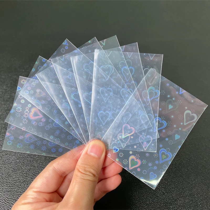 納期21日～100個ボードゲームtcgカードスリーブ甘いハート箔透明レーザークリアygo pkmフォトプロテクタートレーディングカードシールドカバー