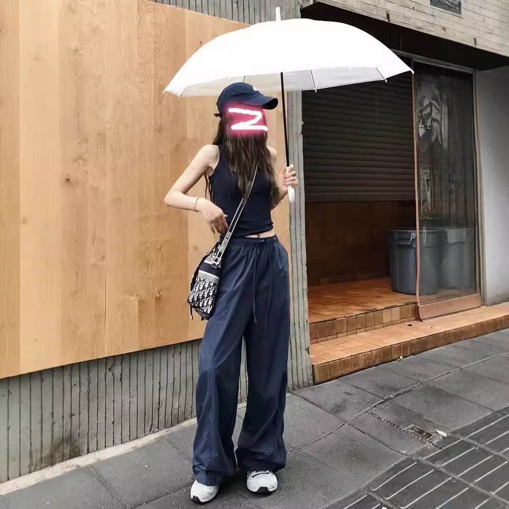 ヨーロッパとアメリカのストリートワークウェアパンツ男性と女性向けのスポーツドレープのルーズカジュアルパンツワイドレッグパンツのライブブロードキャストに適しています