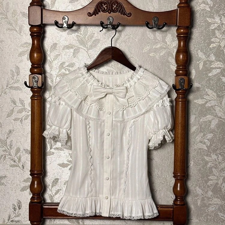 Lolita自家製海塩童話純綿中にロリータ丸襟シャツを掛けて底泡袖肩上着を打ちます 4,934円