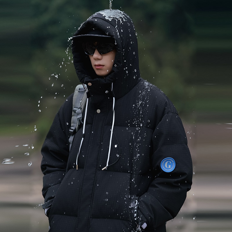 冬はゆったり厚手の短いダウンジャケット湿った男装の白いアヒルの綿毛保温の大きいサイズのコートは防水です