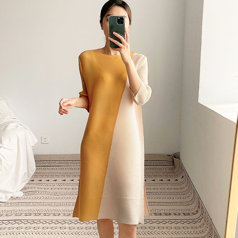 婦人服の中のロングスカートは雰囲気をつなぎ合わせて通勤します