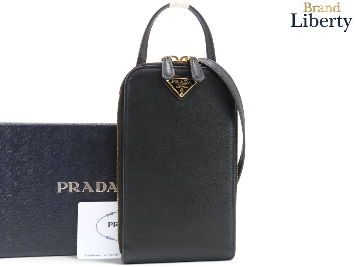 ほぼ新品プラダPRADAサフィアーノスマートフォンケースフォンポーチポシェット斜め掛けショルダーバッグNEROブラックレザー1BP027