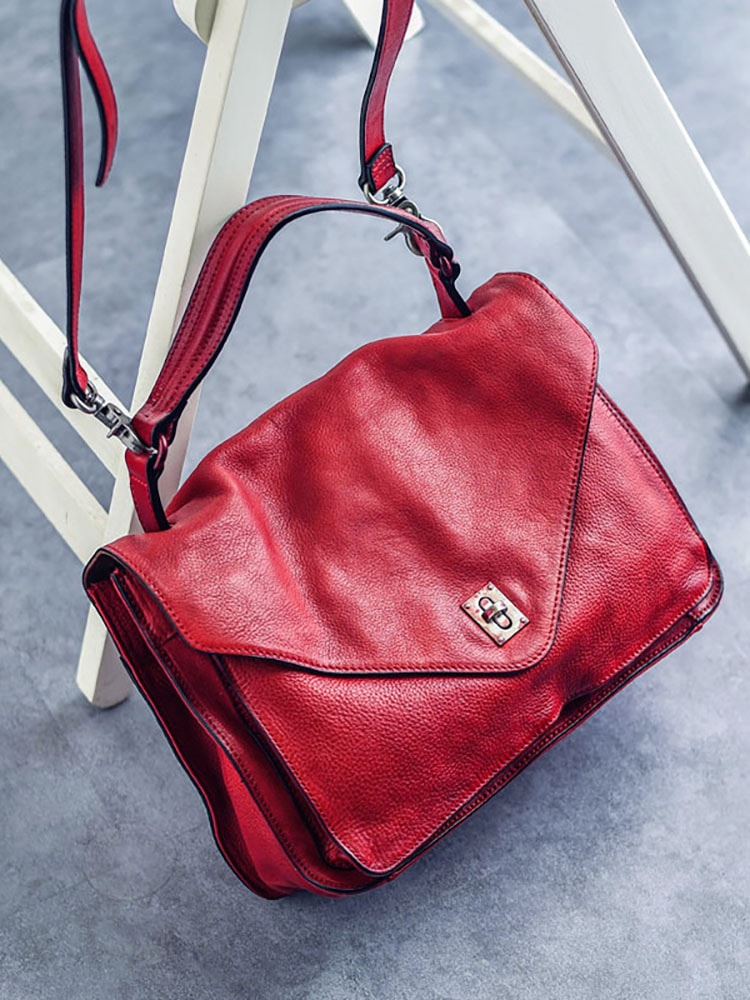 オリジナルの手の柔らかい皮の封筒の包みシンプルなレトロな頭の層牛革の肩の包み郵便配達の包み本革の斜め掛けの女性の包みは大きいです