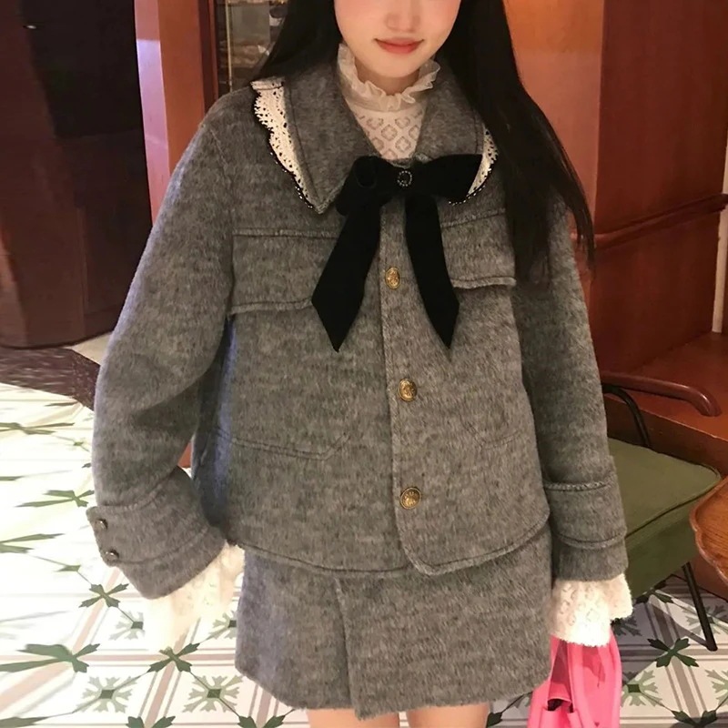 韓国風のエレガントなスリミングと暖かいレディースツーピースセット春と秋長袖ウールコートスリミングとユニークなスタイルミディスカート