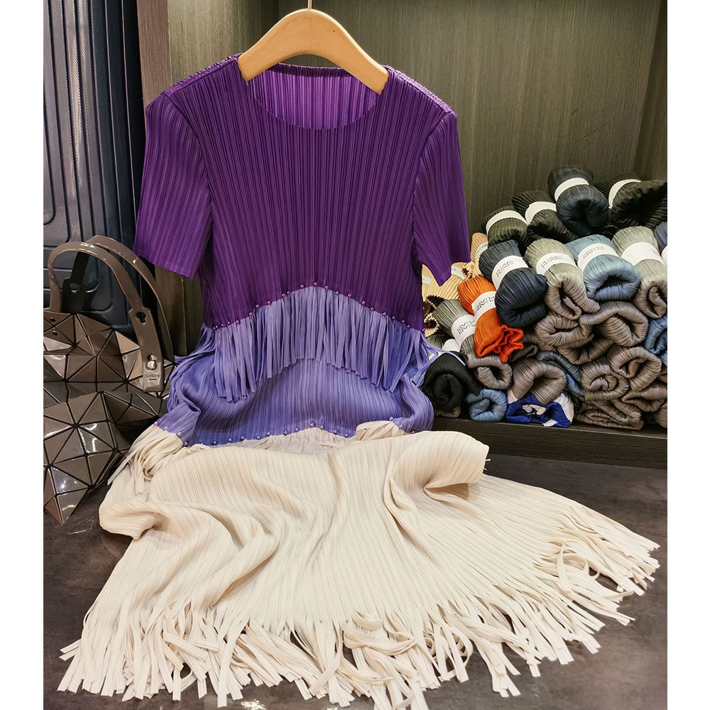 フリンジのしわのワンピースの気質の通勤の丸首の半袖の中で長いスカートの夏