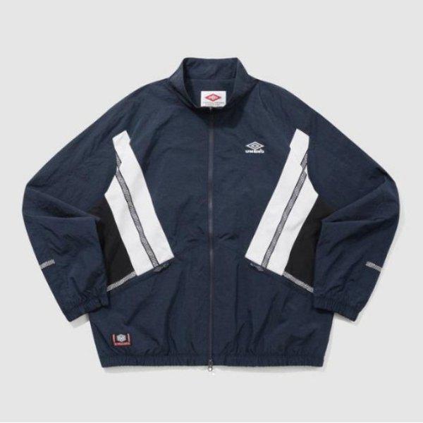 ウィンドブレーカー TQT UQ121CJK23-DVY HBL ノッティンガム スタンネック ウォームアップ ウィンドブレーカージャケット DVY