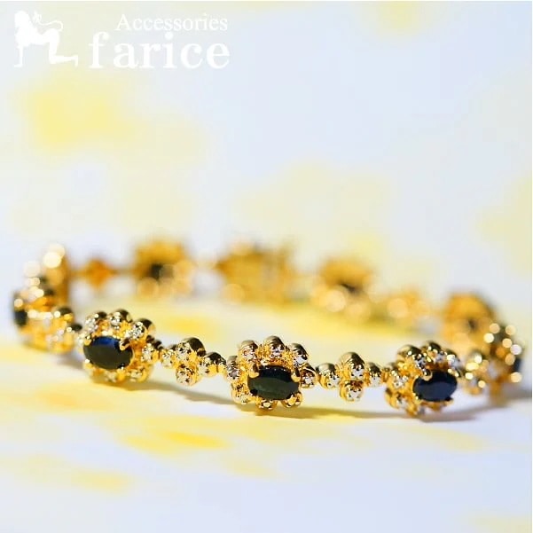 オーバルブリリアントカット ダークブルーブラック天然石 ラウンド銀の玉装飾 エレガントフラワー(花)デザイン イエローゴールドコーティング レディース シルバージュエリー ブレスレット