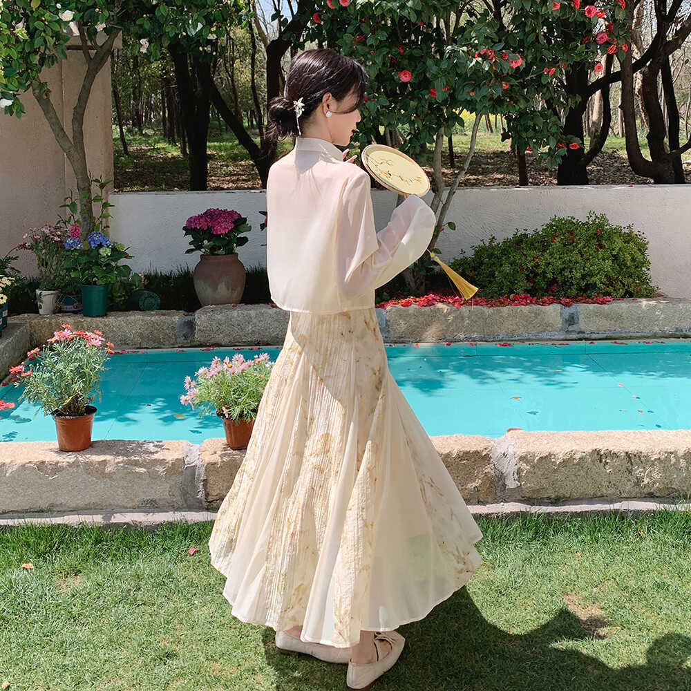 新しい中国の国家スタイルのディスクバックル花ホルタードレスツーピース2024新しい夏の妖精テンセルロングスカート