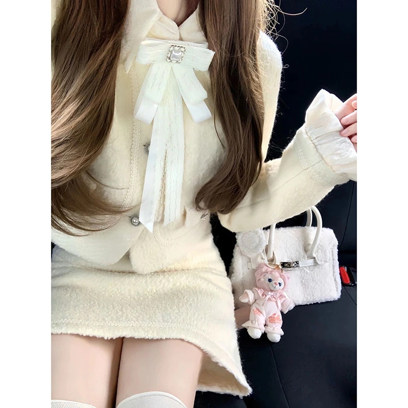 シャネル風のレーストリムカーディガン甘くスリムなデザインウエストにフィットしたスカートが特徴の春と秋にぴったりのレディース ツーピース セットです