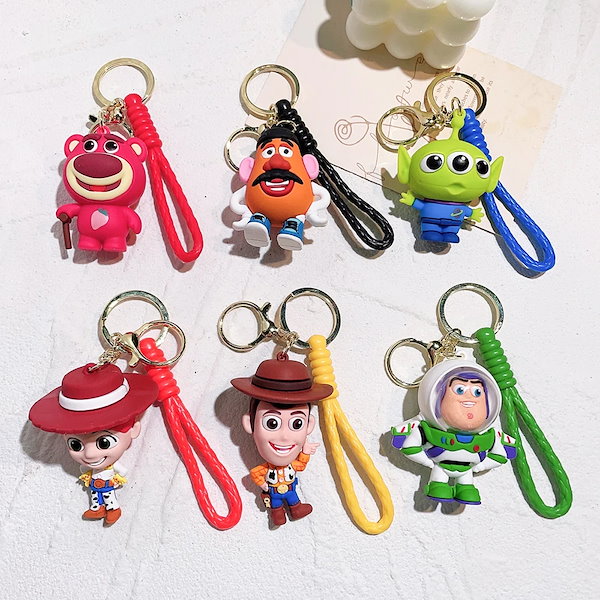 Qoo10] トイストーリーのキーホルダー,3つのアイ