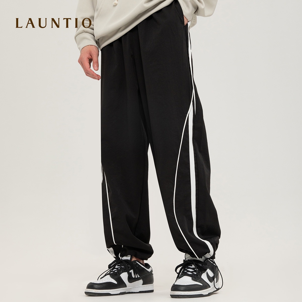 ドラゴンストレートカジュアルパンツメンズ2025トレンドスポーツコントラストカラーラインスプライシングルーズパンツメンズ