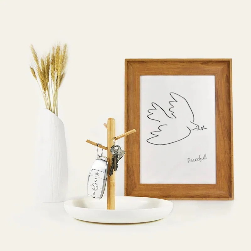 北欧の枝のトレーの客間の玄関の鍵は棚の雑品のデスクトップの化粧品の収納盤の携帯の間食の果物の皿を掛けます