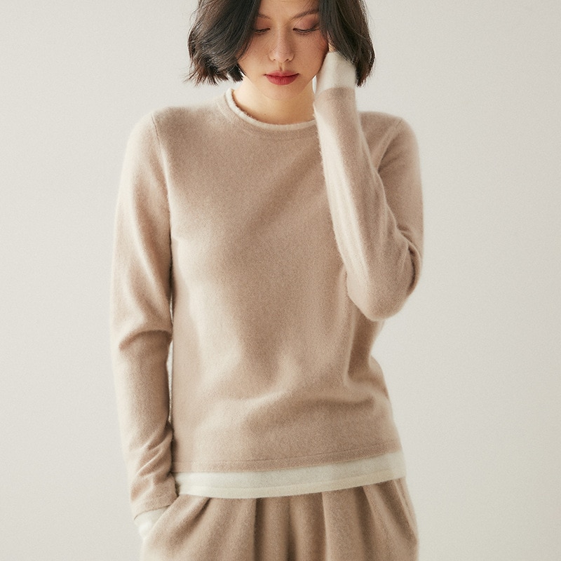 気質の通勤風が偽のカシミヤの中に二重の丸首を掛けて縁を巻いて設計してセーターを編みます