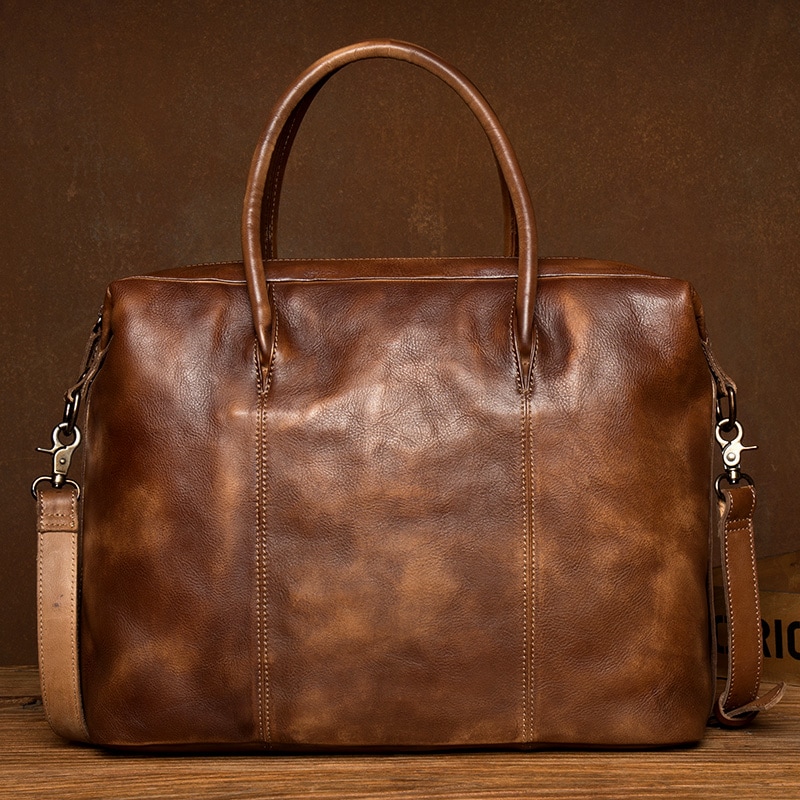 ゆっくりした時間の純粋な手で色を拭いて手を提げて頭を包む牛革の男の包み商務のレジャーのブリーフケース本革の単肩の包み