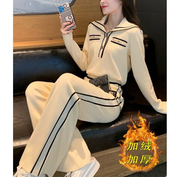 ハイエンドのカスタマイズ-女性のためのファッションスーツ 2025 秋と冬の新しいデザインのニッチと西洋スタイルの年齢を軽減するネイビーカラーのトップとパンツの 2 点セット