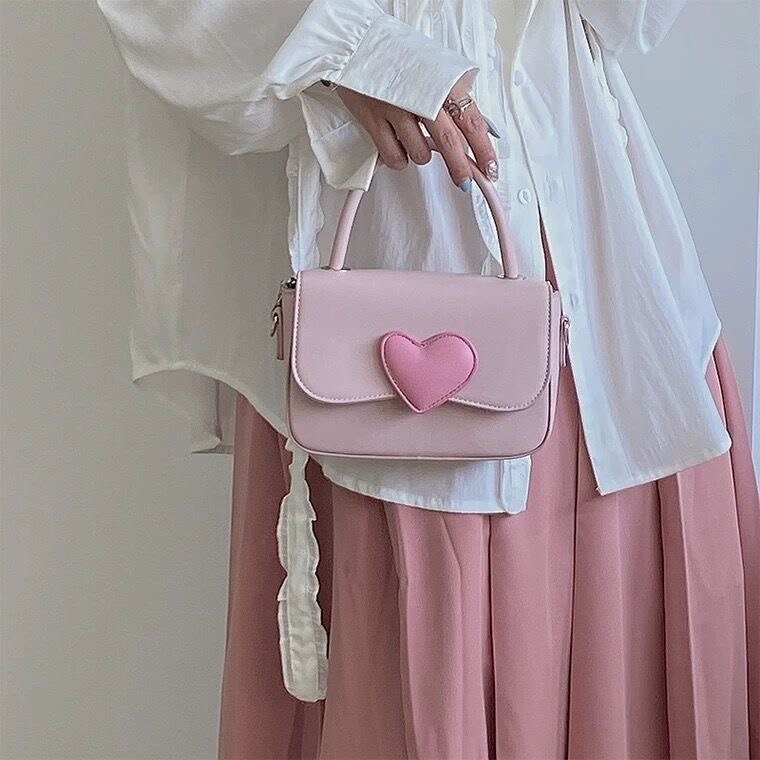 ピンクの愛が色にぶつかる少女のかわいい小方包2025夏の新型のファッションの高級感の手提げチェーンの