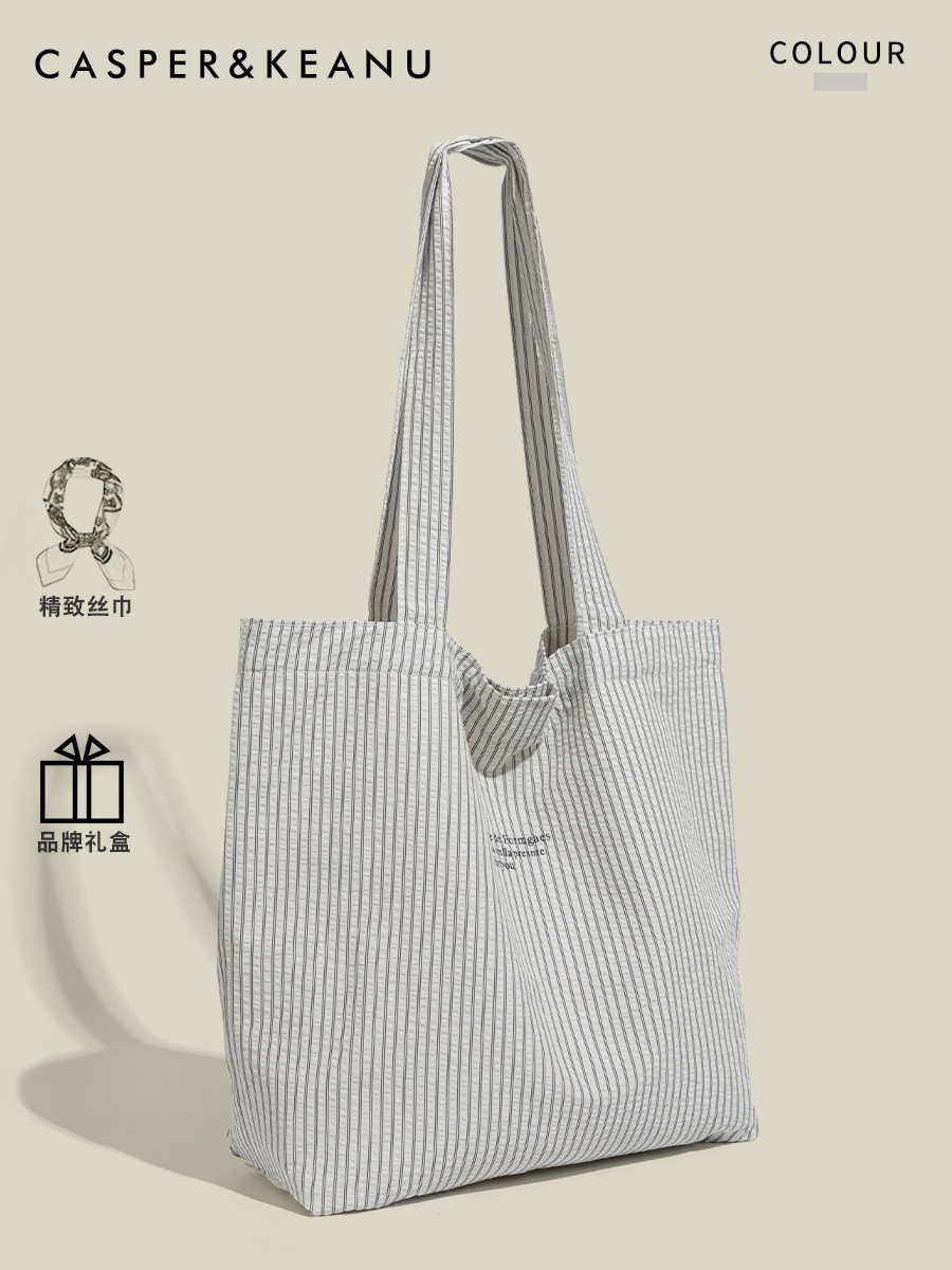 韓国系の怠惰な風の大容量の特包2025新型夏の通勤ストライプのキャンバスバッグ 5,320円