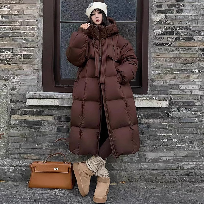 白鴨絨毛の長いダウンジャケット女性冬の新しいファッションは帽子もゆったりとした保温膝コートを厚くした 5,543円