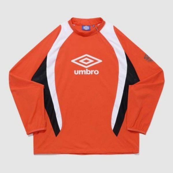 長袖Tシャツ KQF UQ121SWT21-ORG PTR ウォーミングアップ ハイネック ピステ ORANGE