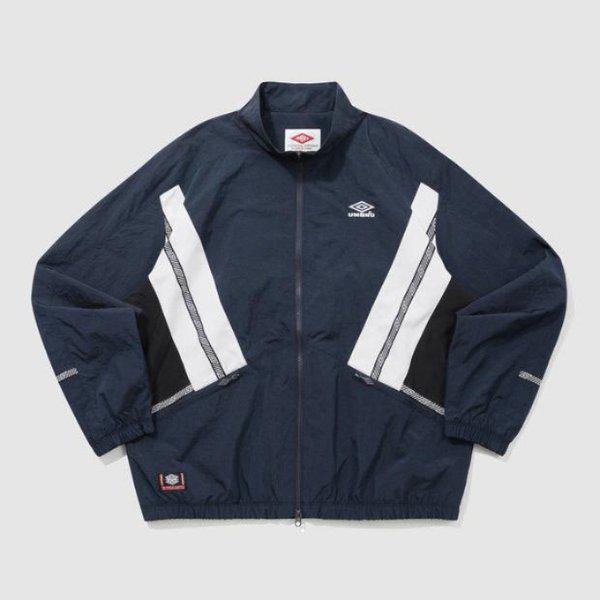 ウィンドブレーカー TQT UQ121CJK23-DVY HBL ノッティンガム スタンネック ウォームアップ ウィンドブレーカージャケット DVY