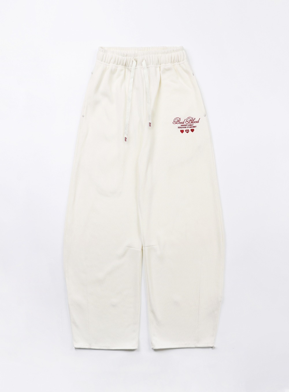 【BADBLOOD】[UNISEX] CLASSIC LOGO 2WAY CURVED JOGGER TROUSERS : CREAM