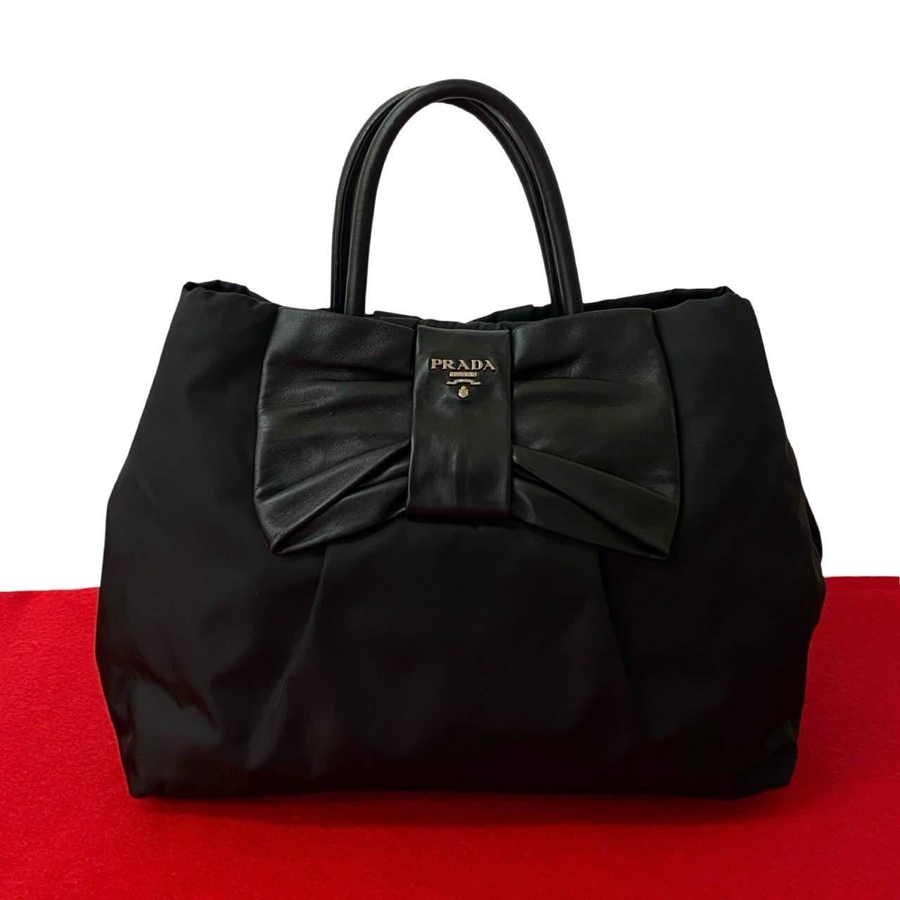 ロゴ 金具 リボン モチーフハンドバッグ ナイロン レザー ブラック 421-5