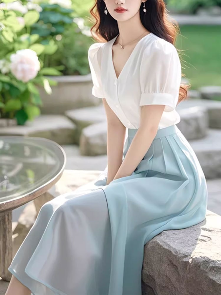 2025夏季の新モデルの気質はファッションの高級感を着てそろいます半袖のシャツの半身のスカートの2件のスーツの女性