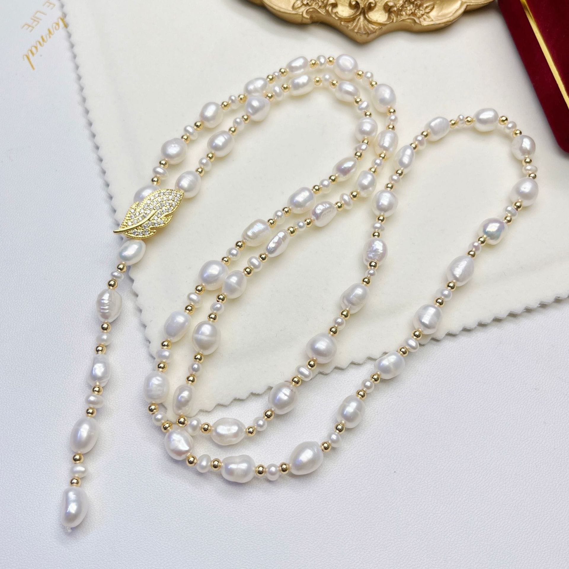 ネットルーツファッショニスタはマルチ摩耗葉天藍淡水パールネックレスロングジャンパーチェーンウエストチェーンをお勧めします