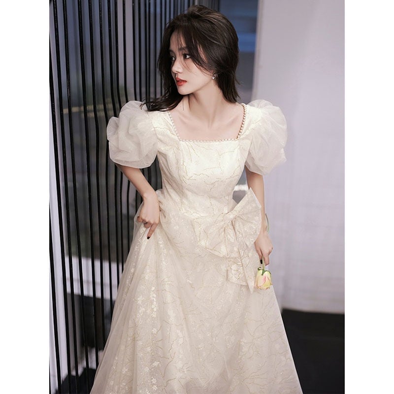 逃亡者プリンセススタイルのイブニングドレス 2025 新しいハイエンドライト高級ニッチシャンパンカラー大人のセレモニーアート試験の誕生日ドレス